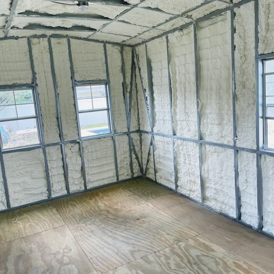 Closed-cell spray foam insulation applied to wall cavities in a residential project in Mansfield